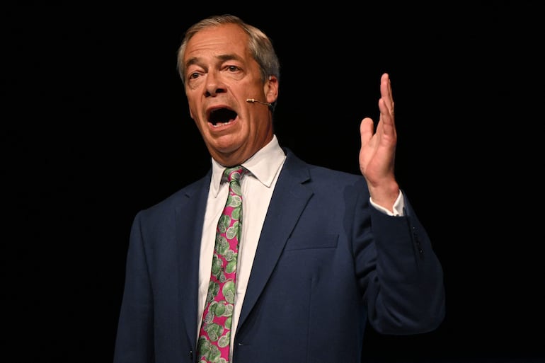 Reform UK leader Nigel Farage delivers a speech during the 'Rally for Reform' at the National Exhibition Centre in Birmingham on June 30, 2024 in the build-up to the July 4 general election. (Photo by JUSTIN TALLIS / AFP)