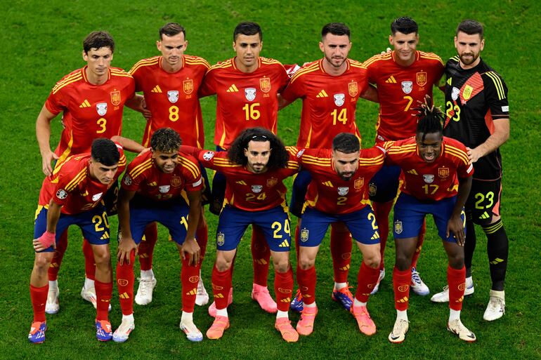 (From L) Spain's defender #03 Robin Le Normand, Spain's forward #19 Lamine Yamal, Spain's midfielder #08 Fabian Ruiz, Spain's defender #24 Marc Cucurella, Spain's defender #14 Aymeric Laporte, Spain's defender #02 Dani Carvajal, Spain's forward #07 Alvaro Morata, Spain's midfielder #17 Nico Williams and Spain's goalkeeper #23 Unai Simon and Spain's midfielder #20 Pedri pose ahead of the UEFA Euro 2024 Group B football match between Spain and Italy at the Arena AufSchalke in Gelsenkirchen on June 20, 2024. (Photo by INA FASSBENDER / AFP)