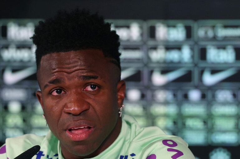 Brazil's forward Vinicius Junior cries as he gives a press conference on the eve of the international friendly football match between Spain and Brazil at the Ciudad Real Madrid training ground in Valdebebas, outskirts of Madrid, on March 25, 2024. Spain arranged a friendly against Brazil at the Santiago Bernabeu under the slogan "One Skin" to help combat racism. (Photo by Pierre-Philippe MARCOU / AFP)