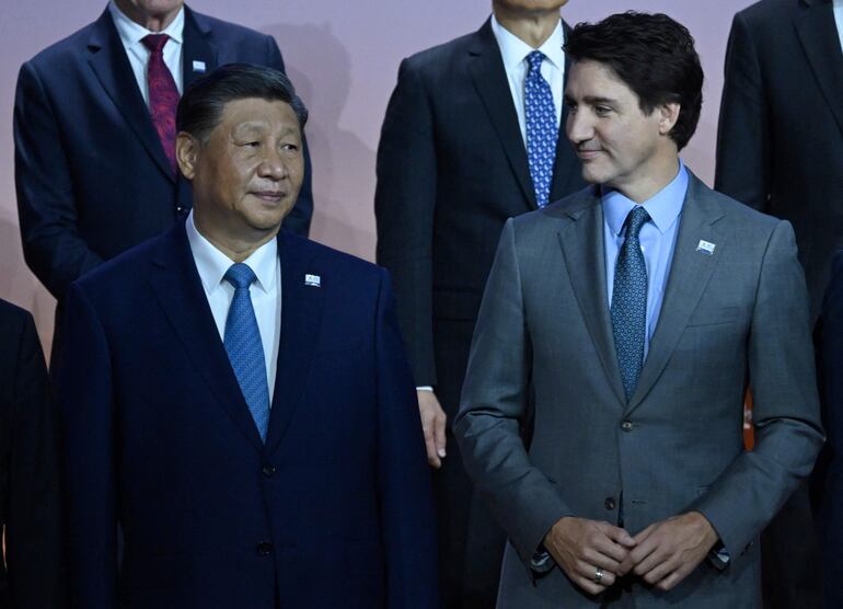 El presidente chino Xi Jingping y el primer ministro canadiense Justin Trudeau.