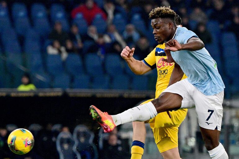 Lazio's Nigerian midfielder #07 Fisayo Dele-Bashiru (R) shoots towards goal during the Italian Serie A football match between Lazio and Atalanta at Olympic stadium in Rome on December 28, 2024. (Photo by tiziana fabi / AFP)