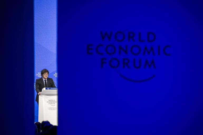 Argentinas President Javier Milei addresses the audience during the World Economic Forum (WEF) annual meeting in Davos on January 23, 2025. Milei said at a Bloomberg event on January 22, 2026 that "The world should celebrate the arrival of President Trump,"before Donald Trump will star on January 23, 2025 in an eagerly-anticipated online appearance at the World Economic Forum in Davos, addressing global elites whose annual gabfest has been consumed by the US president's days-old second term. (Photo by FABRICE COFFRINI / AFP)