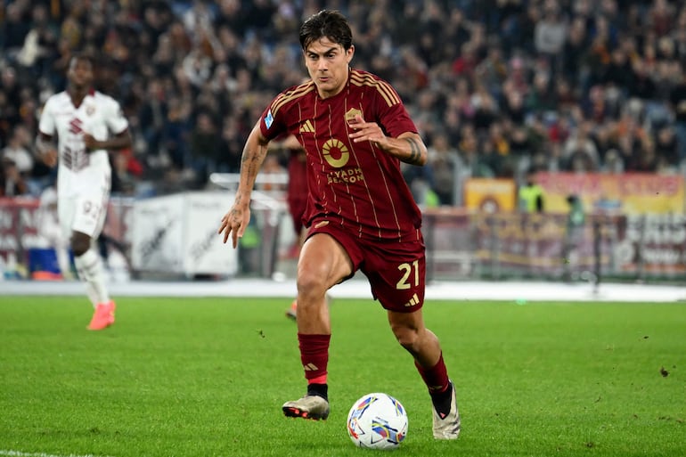 Roma's Argentinian forward #21 Paulo Dybala drives the ball during the Italian Serie A football match between AS Roma and Torino at the Olympic stadium in Rome on October 31, 2024. (Photo by Alberto PIZZOLI / AFP)