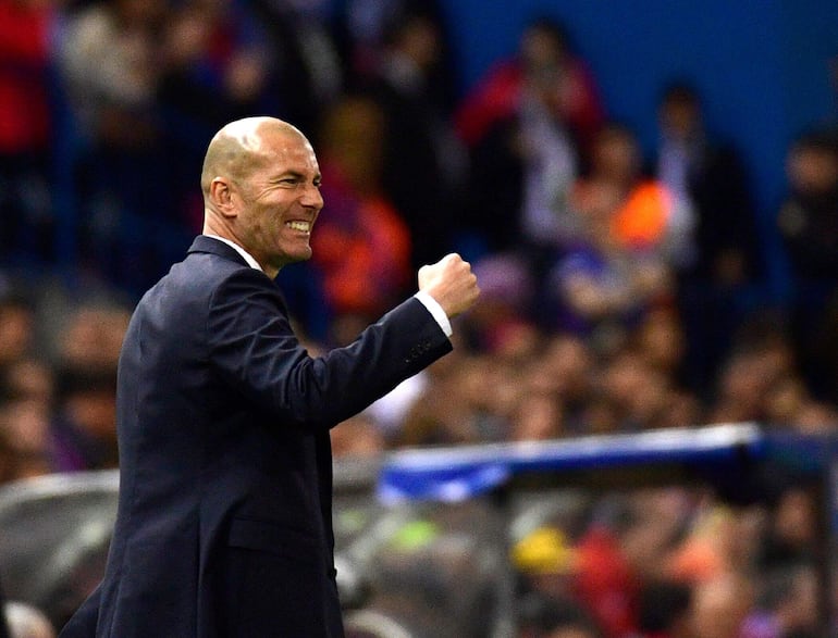 (FILES) Real Madrid's French coach Zinedine Zidane gestures on the sideline during the UEFA Champions League semi final second leg football match Club Atletico de Madrid vs Real Madrid CF at the Vicente Calderon stadium in Madrid, on May 10, 2017. France's 2018 World Cup-winning coach Didier Deschamps announced on January 8, 2025, that he will leave his post after the 2026 tournament in North America, Zinedine Zidane, who won the 1998 World Cup as a player alongside Deschamps, has long been tipped as the favourite to eventually replace him in the dugout. (Photo by PIERRE-PHILIPPE MARCOU / AFP)