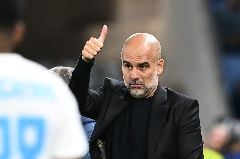 Manchester City's Spanish manager Pep Guardiola gives a thumbs up during the UEFA Champions League football match between SK Slovan Bratislava and Manchester City in Bratislava, Slovakia on October 1, 2024. (Photo by Joe Klamar / AFP)