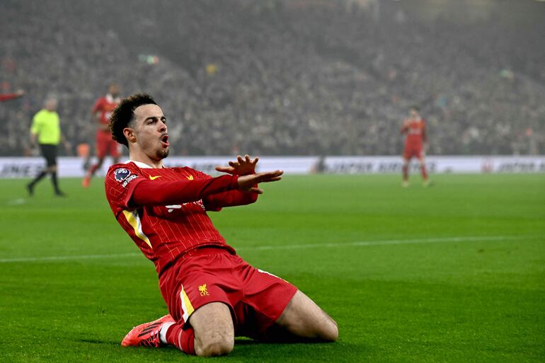 Liverpool's English midfielder #17 Curtis Jones celebrates scoring the team's second goal during the English Premier League football match between Liverpool and Leicester City at Anfield in Liverpool, north west England on December 26, 2024. (Photo by Paul ELLIS / AFP) / RESTRICTED TO EDITORIAL USE. No use with unauthorized audio, video, data, fixture lists, club/league logos or 'live' services. Online in-match use limited to 120 images. An additional 40 images may be used in extra time. No video emulation. Social media in-match use limited to 120 images. An additional 40 images may be used in extra time. No use in betting publications, games or single club/league/player publications. / 