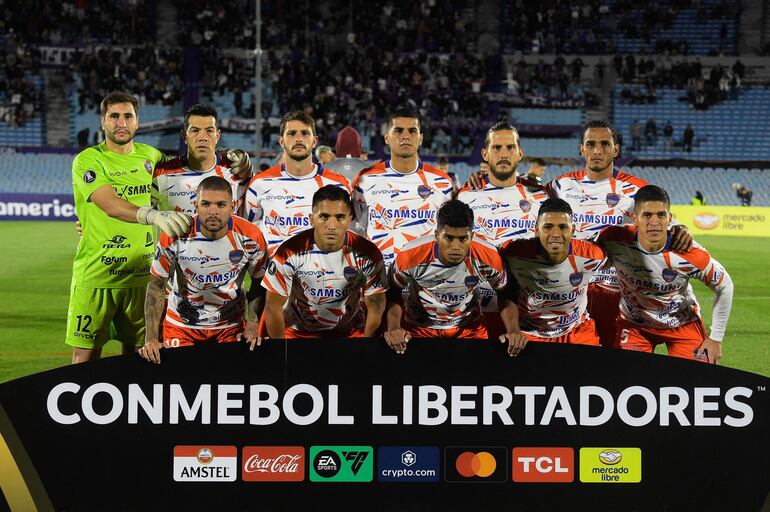 Puerto Cabello players pose for a team photo during the Copa Libertadores' first round second leg football match between Defensor Sporting and Puerto Cabello at the Centenario stadium in Montevideo on February 13, 2024. (Photo by Dante Fernandez / AFP)