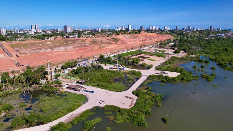 EDITORS NOTE: Graphic content / Aerial view of the sunken ground in a plot of land at the Mutange neighbourhood in Maceio, Alagoas state, Brazil on December 1, 2023. The affected area is close to a rock salt mine and has already sunk about two meters, forcing 55,000 residents and a hospital to evacuate. (Photo by Robson Barbosa / AFP)