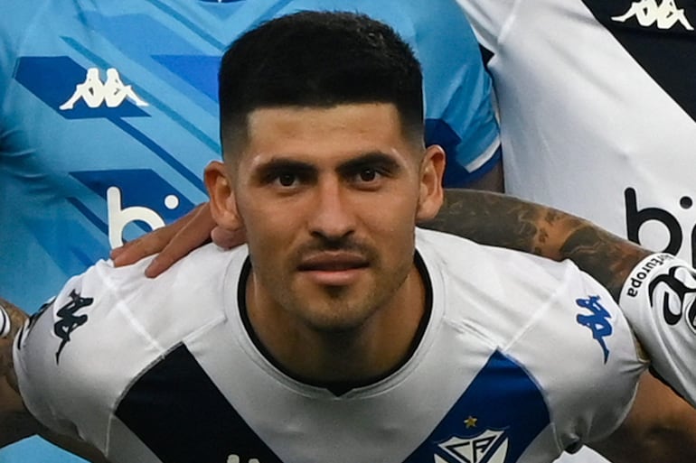 (FILES) Velez Sarsfield's Paraguayan midfielder Jose Florentin poses for a team photo during the Copa Libertadores second leg semifinal football match between Flamengo and Velez Sarsfield, at the Maracana stadium in Rio de Janeiro, Brazil, on September 7, 2022. Three professional footballers in Argentina linked to the alleged rape of a sports journalist in a hotel room were placed under house arrest on March 21, 2024. The case arose after a 24-year-old sports journalist alleged she was raped after being invited by Uruguay international Sebastian Sosa to a hotel room in Tucuman, Argentina, on March 3, where she said the other three defendants were also waiting.Prosecutor Eugenia Posse is looking to bring rape charges against players Braian Cufre and Jose Florentin, while Abiel Osario is accused of sexual abuse. Sosa, who was granted $57,000 bail and banned from leaving the country for 90 days, is being charged as a secondary participant. (Photo by MAURO PIMENTEL / AFP)