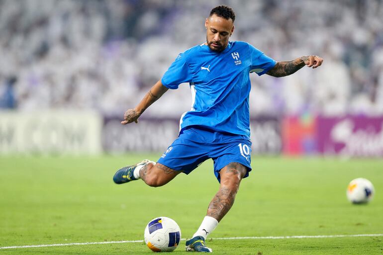 TOPSHOT - Hilal's Brazilian forward #10 Neymar warms up ahead of the AFC Champions League group B football match between UAE's Al-Ain and Saudi's Al-Hilal at the Hazza bin Zayed Stadium in al-Ain on October 21, 2024. (Photo by AFP)