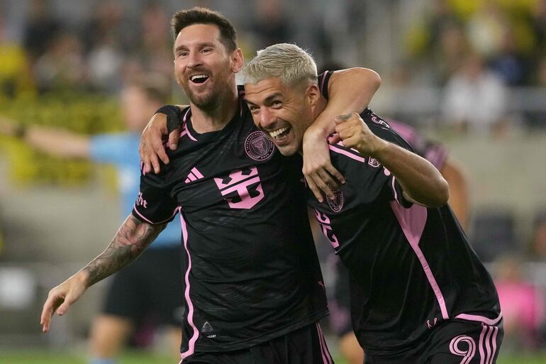 COLUMBUS, OHIO - OCTOBER 02: Lionel Messi #10 and Luis Suarez #9 of Inter Miami CF celebrate a goal during the second half against the Columbus Crew at Lower.com Field on October 02, 2024 in Columbus, Ohio.   Jason Mowry/Getty Images/AFP (Photo by Jason Mowry / GETTY IMAGES NORTH AMERICA / Getty Images via AFP)