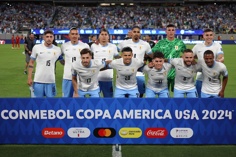 (From bottom, L) Uruguay's defender #17 Matias Vina, Uruguay's forward #20 Maximiliano Araujo, Uruguay's forward #11 Facundo Pellistri, Uruguay's defender #08 Nahitan Nandez, Uruguay's midfielder #07 Nicolas De La Cruz, (from top, L) Uruguay's midfielder #15 Federico Valverde, Uruguay's forward #19 Darwin Nunez, Uruguay's defender #16 Mathias Olivera, Uruguay's defender #04 Ronald Araujo, Uruguay's goalkeeper #01 Sergio Rochet and Uruguay's midfielder #05 Manuel Ugarte pose ahead of the Conmebol 2024 Copa America tournament group C football match between Uruguay and Bolivia at MetLife Stadium in East Rutherford, New Jersey, on June 27, 2024 (Photo by Charly TRIBALLEAU / AFP)