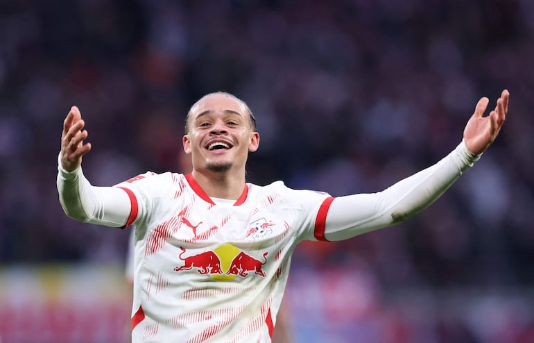 Leipzig's Dutch midfielder #10 Xavi Simons celebrates scoring his team's second goal during the German first division Bundesliga football match between RB Leipzig and SV Werder Bremen in Leipzig, eastern Germany on January 12, 2025. (Photo by Ronny HARTMANN / AFP) / DFL REGULATIONS PROHIBIT ANY USE OF PHOTOGRAPHS AS IMAGE SEQUENCES AND/OR QUASI-VIDEO