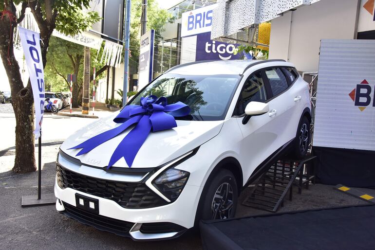 El premio, camioneta Kía Sportage blanca 0km.