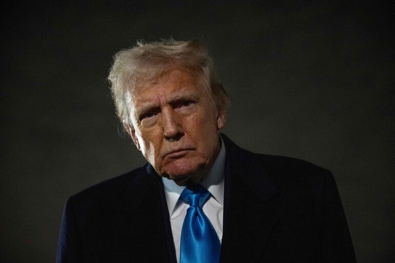 US President Donald Trump speaks to the press upon arrival at Joint Base Andrews in Maryland on February 2, 2025, as he returns to the White House from Florida. (Photo by Jim WATSON / AFP)