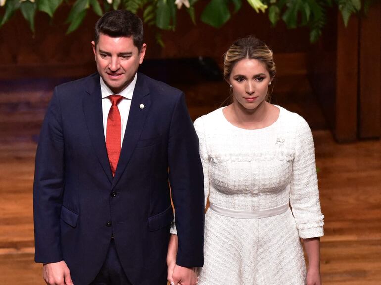 Paraguay's President-elect Santiago Peña (2-L) and his running mate Pedro Alliana (2-R) attend their proclamation ceremony as the country's president and vice president, accompanied by their wives Leticia Ocampos (L) and Fabiana Maria Souto, in Asunción on May 30, 2023. Economist and former finance minister Peña will be sworn-in on August 15. (Photo by NORBERTO DUARTE / AFP)