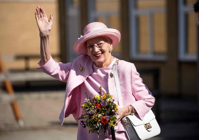 (FILES) Queen Margrethe II of Denmark waves to onlookers as she visits Fredericia Municipality, Denmark, on September 1, 2023, which hosts the Queen's late summer procession. Denmark's popular Queen Margrethe II, Europe's longest-serving monarch, said on December 31, 2023 that she would abdicate on January 14, 2024 and pass the baton to her son Crown Prince Frederik. (Photo by Bo Amstrup / Ritzau Scanpix / AFP) / Denmark OUT