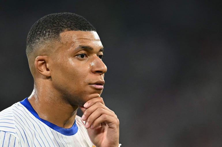 (FILES) France's forward #10 Kylian Mbappe looks on during the UEFA Euro 2024 semi-final football match between Spain and France at the Munich Football Arena in Munich on July 9, 2024. Kylian Mbappe, linked by media to being the target of a rape investigation in Sweden, is to keep any explanations for Swedish justice, "if necessary", his lawyer said on October 17, 2024. (Photo by Fabrice COFFRINI / AFP)