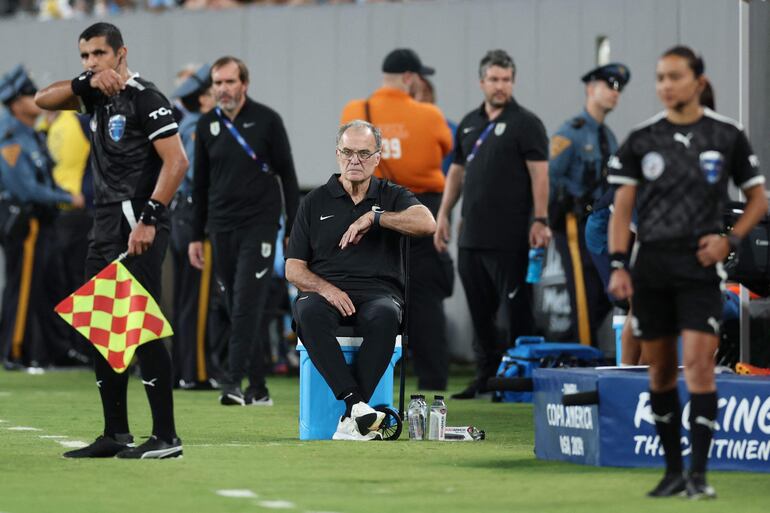 Uruguay's Argentine coach Marcelo Bielsa sits on a cooler during the Conmebol 2024 Copa America tournament group C football match between Uruguay and Bolivia at MetLife Stadium in East Rutherford, New Jersey, on June 27, 2024 (Photo by CHARLY TRIBALLEAU / AFP)