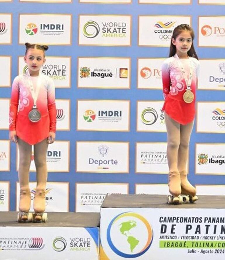 Biabella Dieguez Maldonado y Aika Gasha, plata y oro, respectivamente. en el Panamericano de Patinaje Artístico en Ibagué, Colombia.