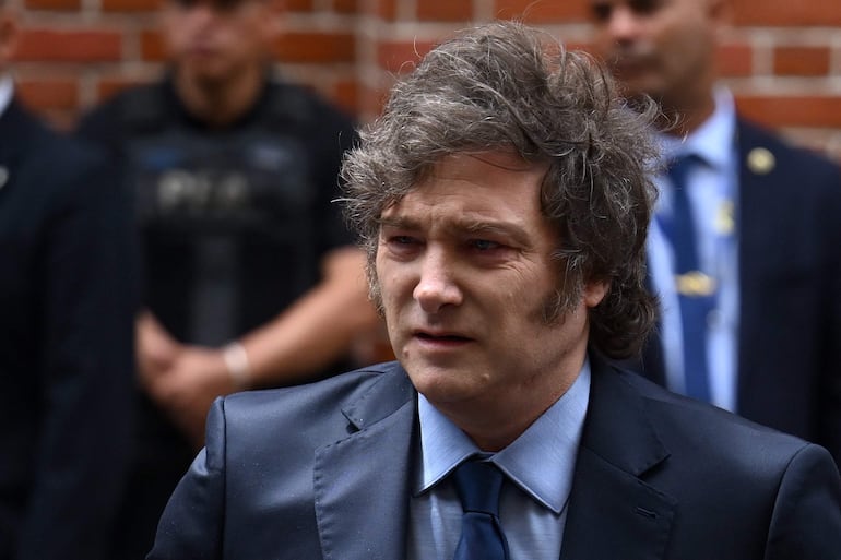 (FILES) Argentina's President Javier Milei leaves the Holocaust Museum after attending an event to commemorate International Holocaust Remembrance Day in Buenos Aires on January 27, 2025. Milei was facing criticism on February 15 after promoting a cryptocurrency whose value soared, then quickly tanked, sparking accusations of fraud and calls for an investigation. (Photo by Luis ROBAYO / AFP)