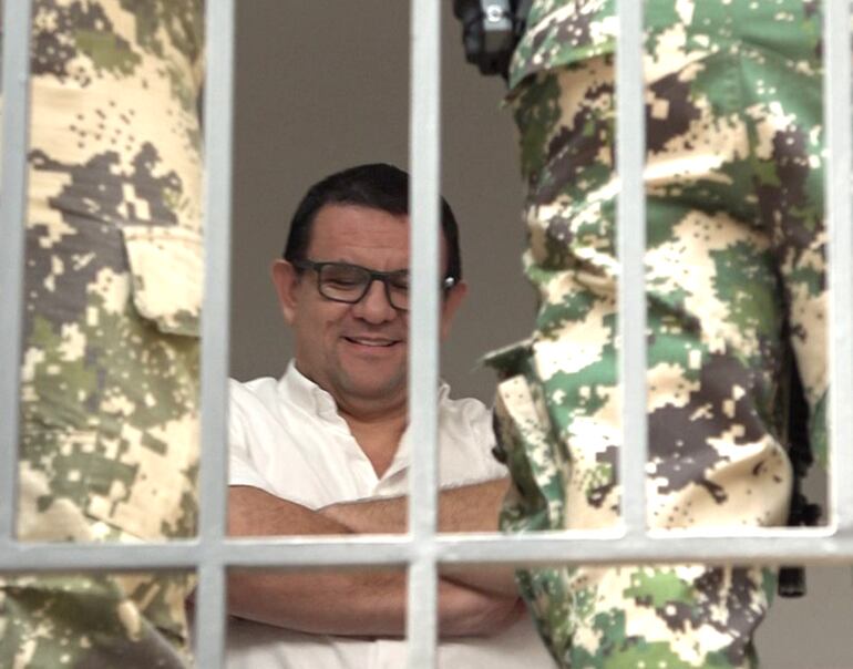 José Alberto Insfrán, relajado y custodiado por militares de Senad, esperaba para declarar.