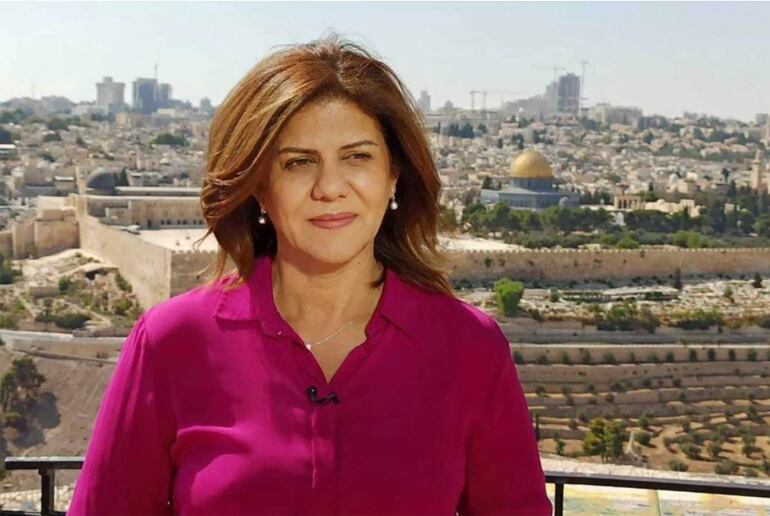 (FILES)This undated handout file photo released by the Doha-based Al-Jazeera TV, shows the channel's veteran journalist Shireen Abu Aqleh (Akleh) during one of her reports from Jerusalem. - Israeli Defense Minister Benny Gantz said on November 14, 2022, that he would not cooperate with a US investigation into the shooting death of a Palestinian-American journalist, likely at the hands of an Israeli soldier. (Photo by AL JAZEERA / AFP) / RESTRICTED TO EDITORIAL USE - MANDATORY CREDIT "AFP PHOTO / Al-Jazeera" - NO MARKETING NO ADVERTISING CAMPAIGNS - DISTRIBUTED AS A SERVICE TO CLIENTS