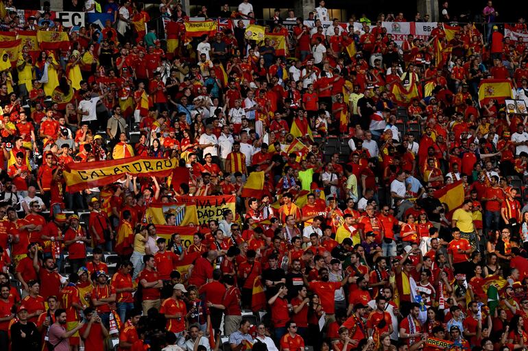 Spain's supporters wave ahead of the UEFA Euro 2024 final football match between Spain and England at the Olympiastadion in Berlin on July 14, 2024. (Photo by INA FASSBENDER / AFP)