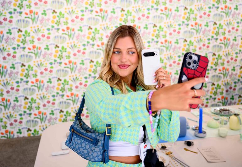 Katarina Mogus takes a photo with a new Pixel phone during the Made By Google event at Google's Bay View campus in Mountain View, California, on August 13, 2024. Google announced new Pixel phones, watches and AI technology. (Photo by Josh Edelson / AFP)